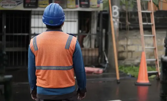 worker wearing hard hat at construction site